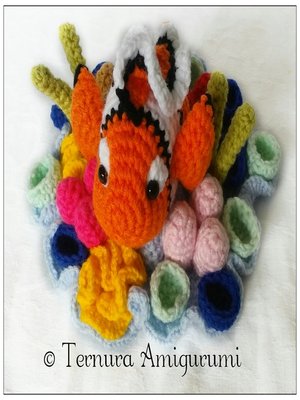 cover image of crochet pattern Nemo clownfish with coral.